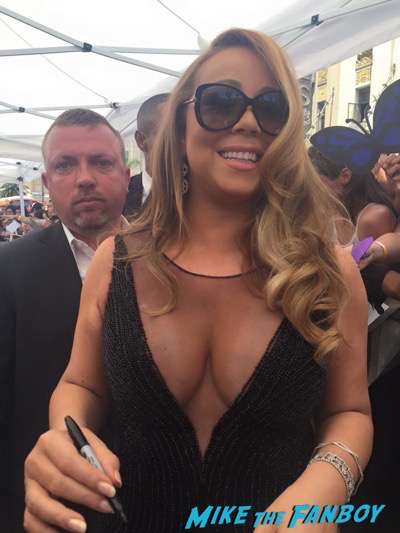 Mariah Carey walk of fame star ceremony signing autographs fan photo 