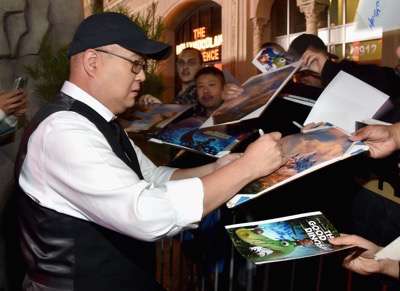 HOLLYWOOD, CA - NOVEMBER 17: Director Peter Sohn signs autographs for fans at the World Premiere Of Disney-Pixar's THE GOOD DINOSAUR at the El Capitan Theatre on November 17, 2015 in Hollywood, California.  (Photo by Alberto E. Rodriguez/Getty Images for Disney) *** Local Caption *** Peter Sohn
