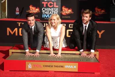 Josh Hutcherson, Jennifer Lawrence and Liam Hemsworth seen at The Hunger Games: Mockingjay Part 2 cast Hand and footprint ceremony at Hollywood Blvd. on Saturday, October 31, 2015, in Los Angeles, CA. (Photo by Eric Charbonneau/Invision for Lionsgate/AP Images)