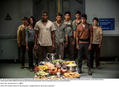MAZE RUNNER: THE SCORCH TRIALS  The surviving Gladers react to something they hadn’t seen a long time: a feast…courtesy of WCKD.  (left to right) Glader (Gary Hood), Teresa (Kaya Scodelario), Frypan (Dexter Darden), Thomas (Dylan O’Brien), Minho (Ki Hong Lee), Newt (Thomas Brodie-Sangster), Winston (Alexander Flores) and Jack (Bryce Romero).  Photo credit:  Richard Foreman, Jr. SMPSP  TM and © 2015 Twentieth Century Fox Film Corporation.  All Rights Reserved.  Not for sale or duplication.