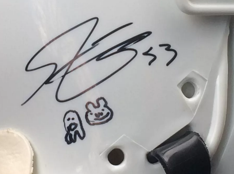 Shayne Gostisbehere's autograph predictably features a ghost and a bear