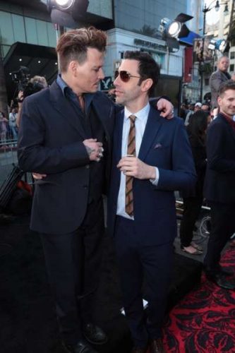 Johnny Depp and Sacha Baron Cohen pose together at The US Premiere of Disney's "Alice Through the Looking Glass" at the El Capitan Theater in Los Angeles, CA on Monday, May 23, 2016.