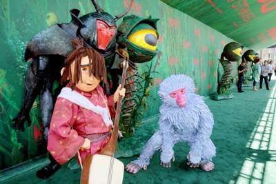 Monkey, Beetle and Kubo seen at Focus Features Los Angeles Premiere of LAIKA "Kubo and The Two Strings" on Sunday, Aug. 14, 2016, in Universal City, Calif. (Photo by Blair Raughley/Invision for Focus Features/AP Images)