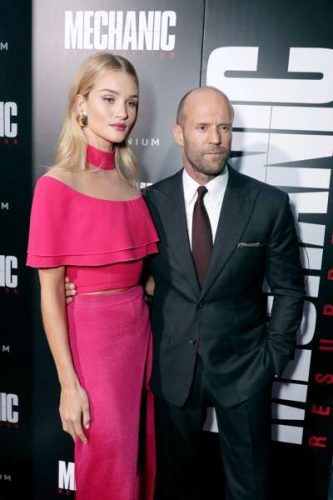 Rosie Huntington-Whiteley and Jason Statham seen at Los Angeles Premiere of "Mechanic: Resurrection" from Lionsgate's Summit Premiere Label at ArcLight Hollywood on Monday, Aug. 22, 2016, in Los Angeles. (Photo by Eric Charbonneau/Invision for Lionsgate/AP Images)