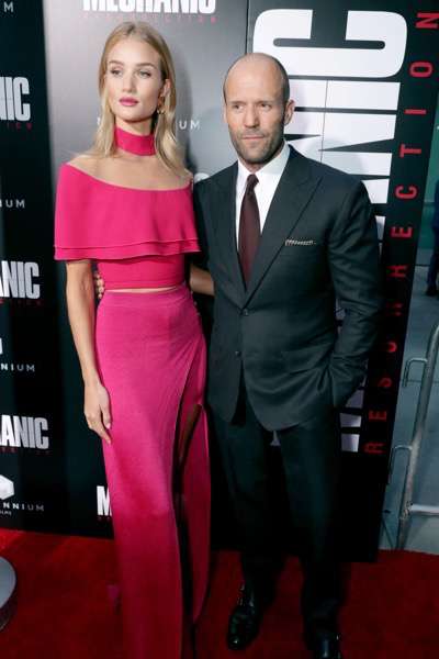 Rosie Huntington-Whiteley and Jason Statham seen at Los Angeles Premiere of "Mechanic: Resurrection" from Lionsgate's Summit Premiere Label at ArcLight Hollywood on Monday, Aug. 22, 2016, in Los Angeles. (Photo by Eric Charbonneau/Invision for Lionsgate/AP Images)
