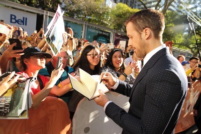 Ryan Gosling signs autographs at Summit Entertainment's "La La Land" premiere at the 2016 Toronto International Film Festival on Monday, Sept. 12, 2016, in Toronto. (Photo by Eric Charbonneau/Invision for LionsgateAP Images)