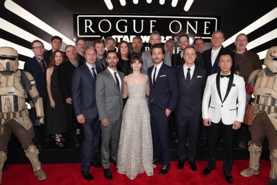HOLLYWOOD, CA - DECEMBER 10: (L-R front row) Actors Mads Mikkelsen, Riz Ahmed, Felicity Jones, Diego Luna, Alan Tudyk and Donnie Yen (back row) Producer Allison Shearmur, Screenwriter Chris Weitz, Walt Disney Studios President Alan Bergman, Executive producer John Knoll, Director Gareth Edwards, Chairman, The Walt Disney Studios, Alan Horn, Producer Kathleen Kennedy, actor Ben Mendelsohn, Composer Michael Giacchino, Producer Simon Emanuel and The Walt Disney Company Chairman and CEO Bob Iger attend The World Premiere of Lucasfilm's highly anticipated, first-ever, standalone Star Wars adventure, "Rogue One: A Star Wars Story" at the Pantages Theatre on December 10, 2016 in Hollywood, California.  (Photo by Rich Polk/Getty Images for Disney) *** Local Caption *** Mads Mikkelsen; Riz Ahmed; Felicity Jones; Diego Luna; Donnie Yen; Allison Shearmur; Chris Weitz; Alan Bergman; John Knoll; Gareth Edwards; Alan Horn; Kathleen Kennedy; Ben Mendelsohn; Michael Giacchino; Simon Emanuel; Bob Iger