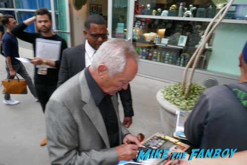 Udo Kier signing autographs with fans 