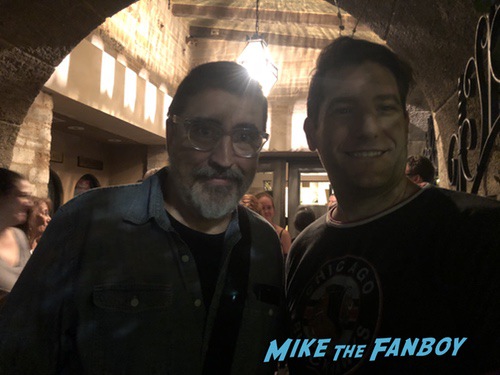 Alfred Molina with fans signing autographs 