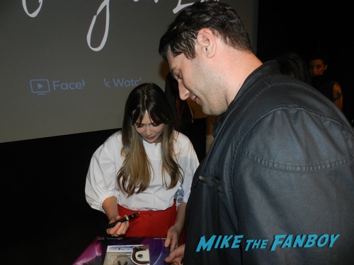 Elizabeth Olsen with fans signing autographs