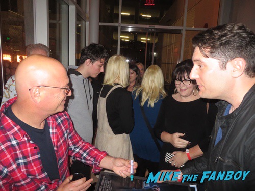 Howie Mandel with fans signing autographs 